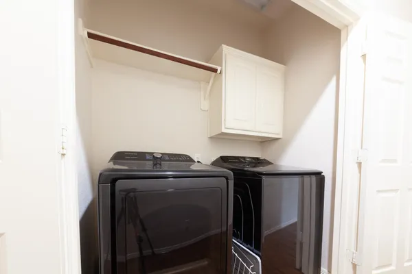 a view of storage and utility room with washer and dryer