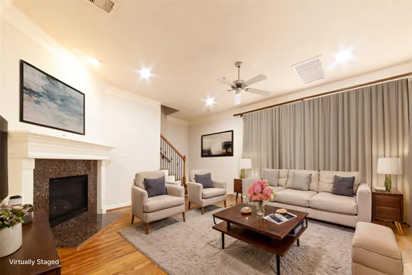 a living room with furniture and a fireplace