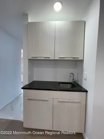 a kitchen with white cabinets
