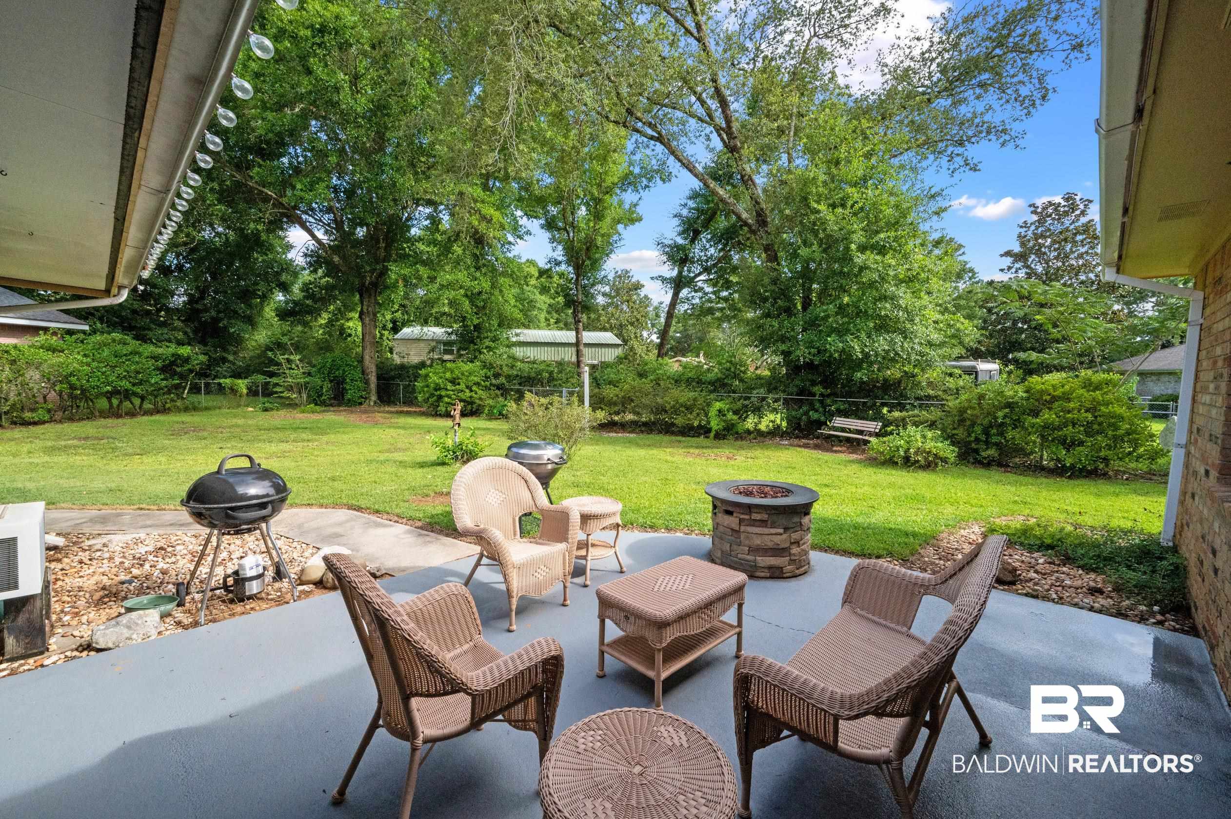 2772 Santa Rosa Circle Lillian, AL 36549 - Photo 29 of 50 View of patio / terrace featuring an outdoor fire pit