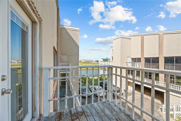 a view of a balcony chairs and dining room