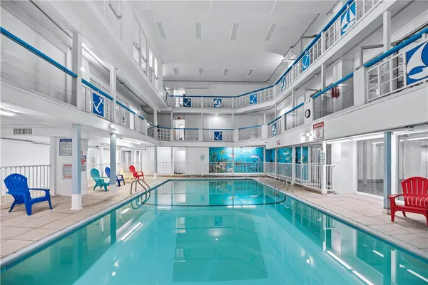 a view of a swimming pool with a patio