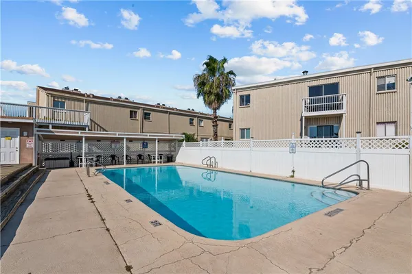 a view of a swimming pool with a lounge chairs