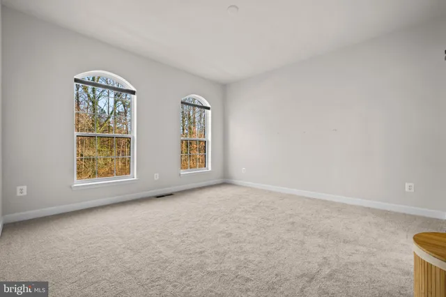 a bathroom with a double vanity sink and mirror