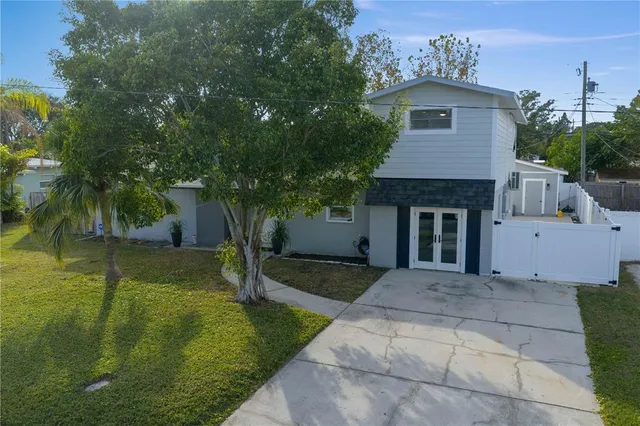 a living room with furniture ceiling fan and a window