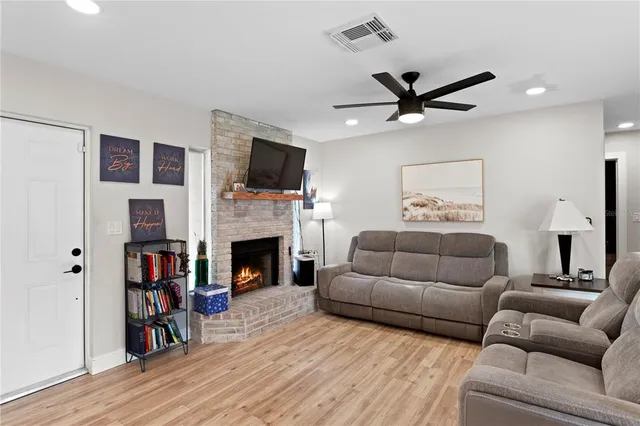 a kitchen with stainless steel appliances granite countertop a sink a stove and cabinets