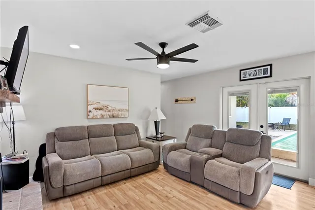 a kitchen with kitchen island granite countertop a sink a counter top space stainless steel appliances and cabinets