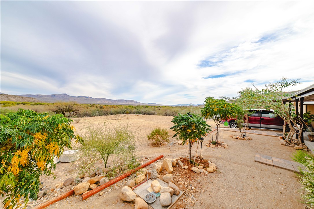 18488 Golf Course Avenue Wikieup, AZ 85360 - Photo 22 of 41 MAIN HOUSE: View of yard featuring a mountain view