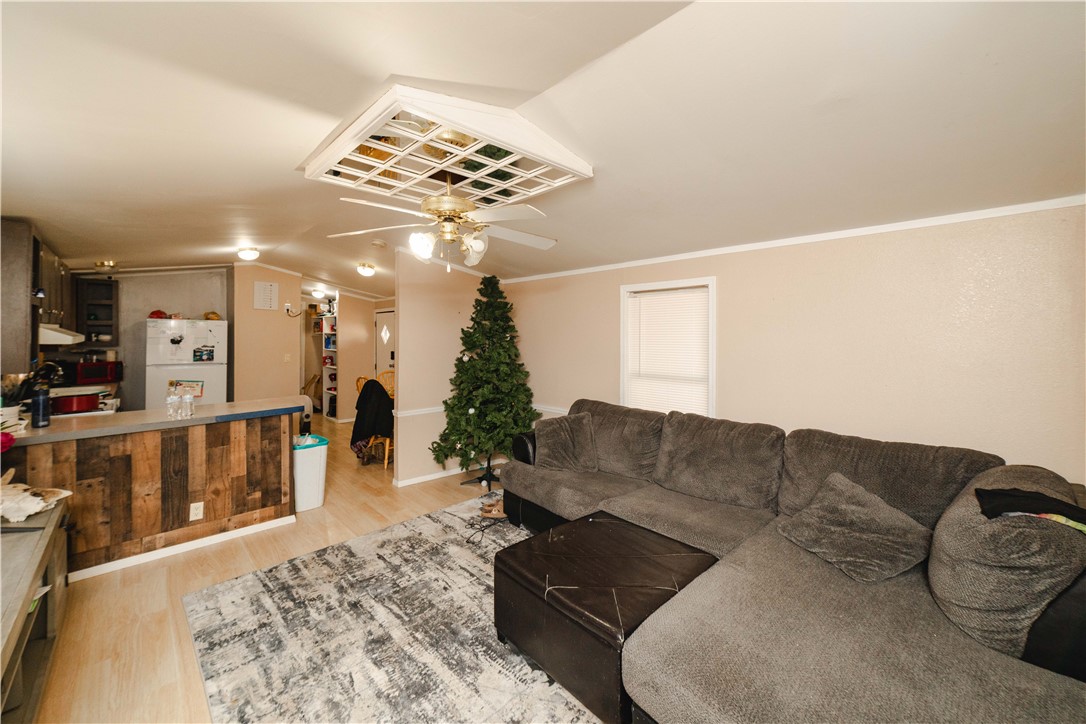 18488 Golf Course Avenue Wikieup, AZ 85360 - Photo 25 of 41 GUEST HOUSE: Living area with lofted ceiling, light wood-style floors, and ceiling fan