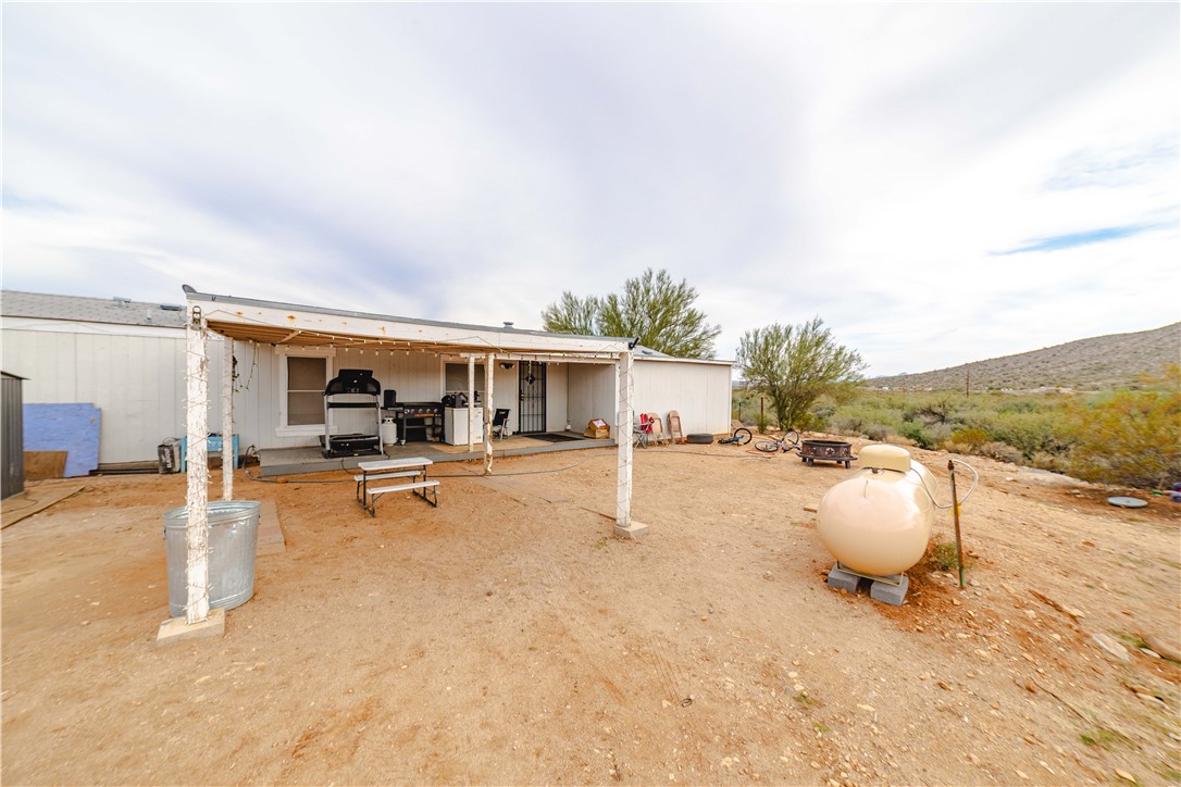 18488 Golf Course Avenue Wikieup, AZ 85360 - Photo 35 of 41 Back of guest house with a patio and a mountain view