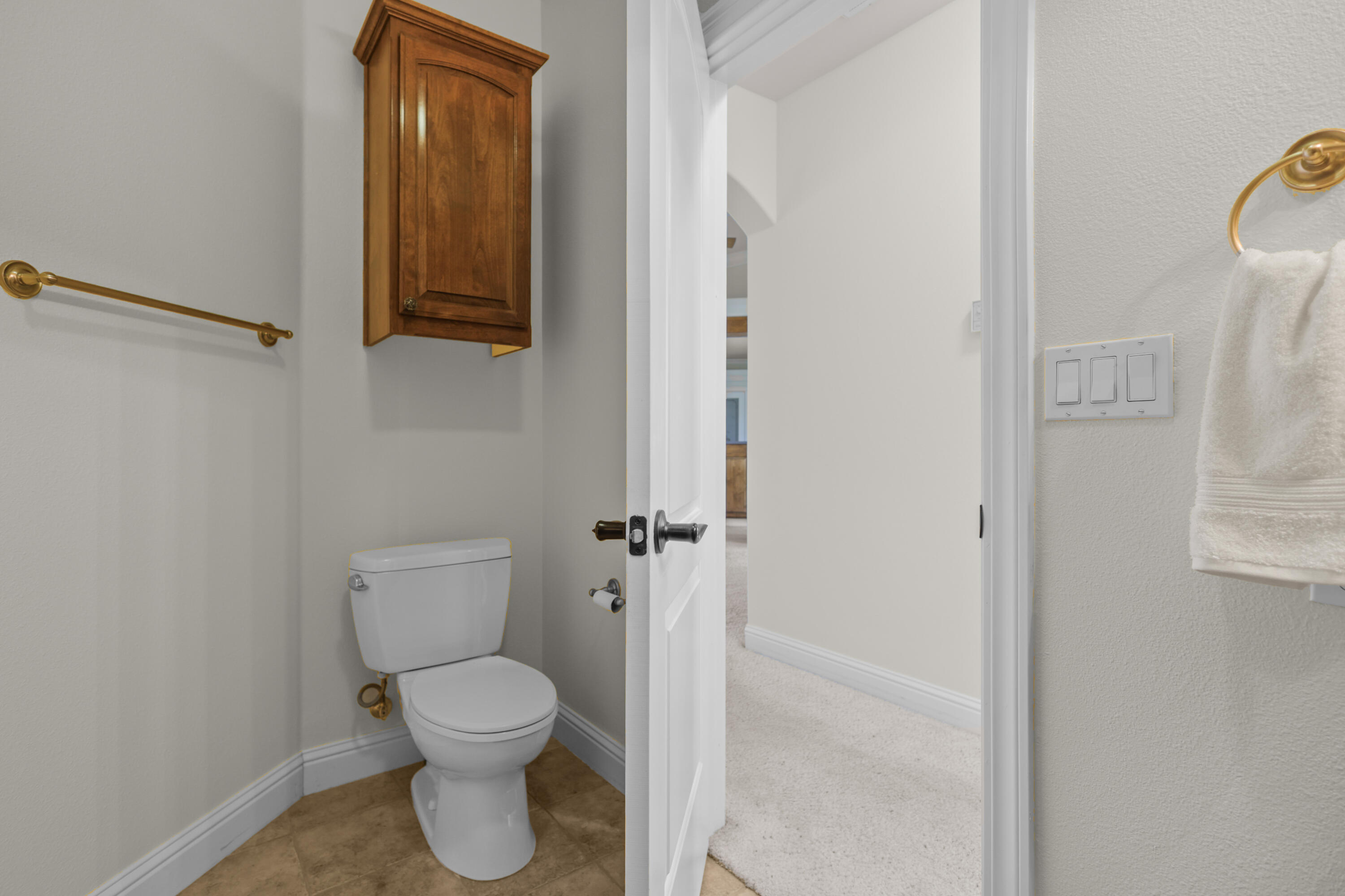 2110 Cadjew Street Redding, CA 96003 - Photo 45 of 62 a bathroom with a toilet and a mirror