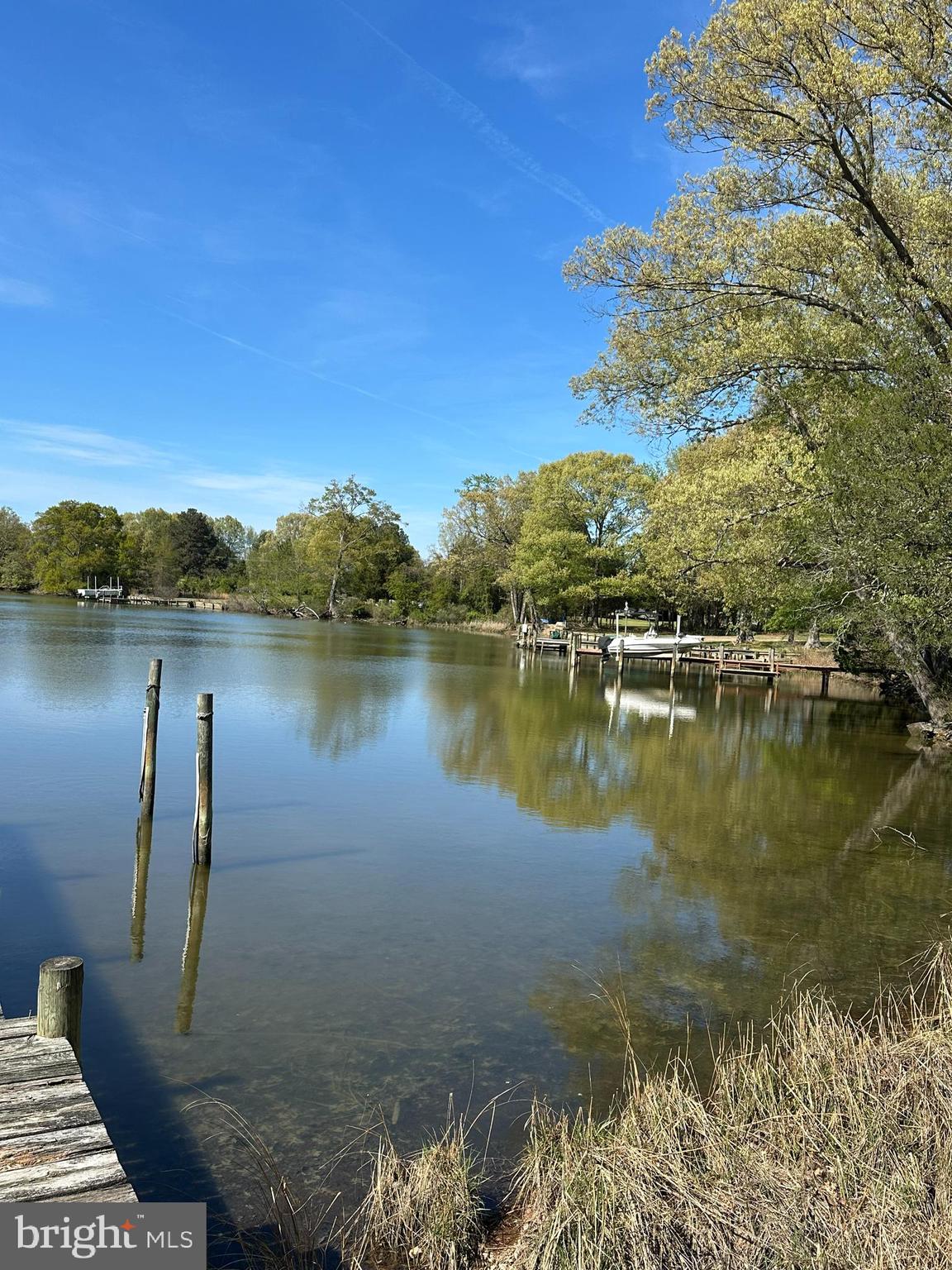 1483 Wilton Road Hague, VA 22469 - Photo 4 of 15 a view of a lake with houses in the back