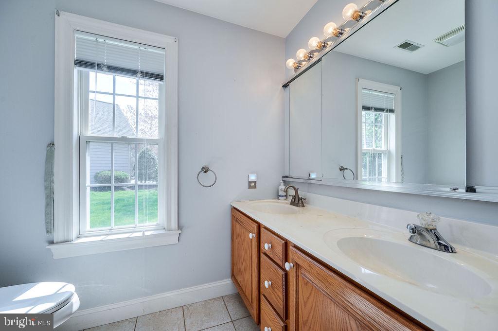 314 Charleston Lane Reading, PA 19610 - Photo 12 of 23 a bathroom with a double vanity sink and a mirror