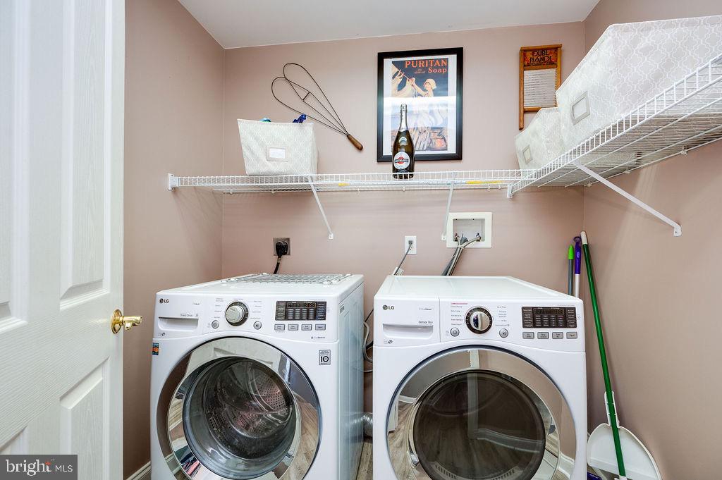 314 Charleston Lane Reading, PA 19610 - Photo 20 of 23 a view of washer and dryer with kitchen in the background