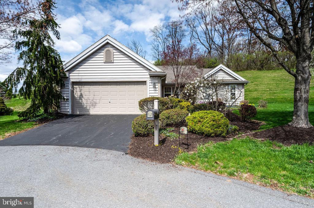 314 Charleston Lane Reading, PA 19610 - Photo 2 of 23 a view of a house with a yard and garage