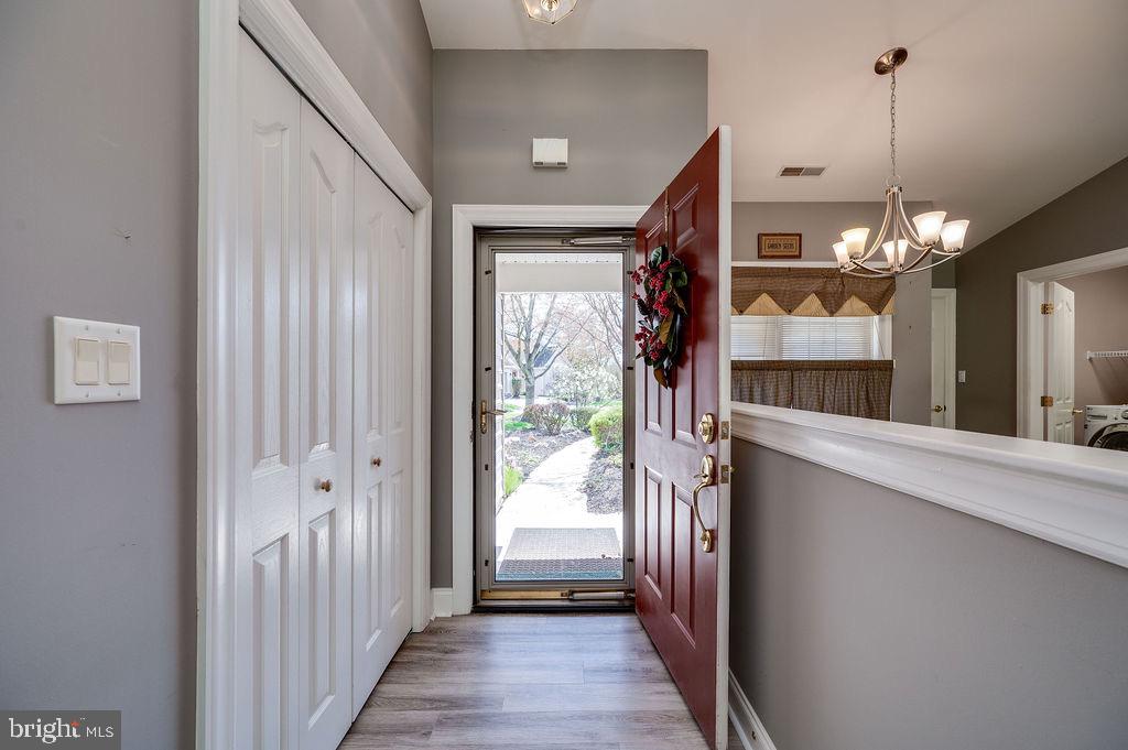 314 Charleston Lane Reading, PA 19610 - Photo 3 of 23 a view of a hallway with a chandelier