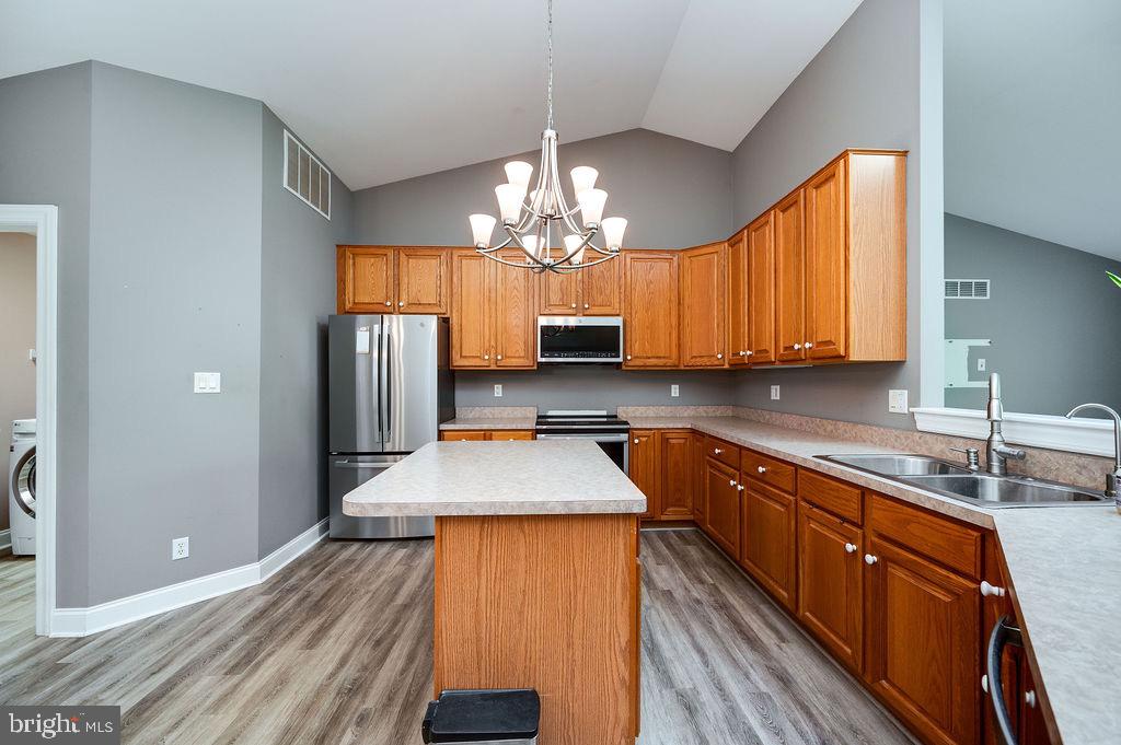 314 Charleston Lane Reading, PA 19610 - Photo 5 of 23 a kitchen with stainless steel appliances granite countertop wooden cabinets a sink and dishwasher