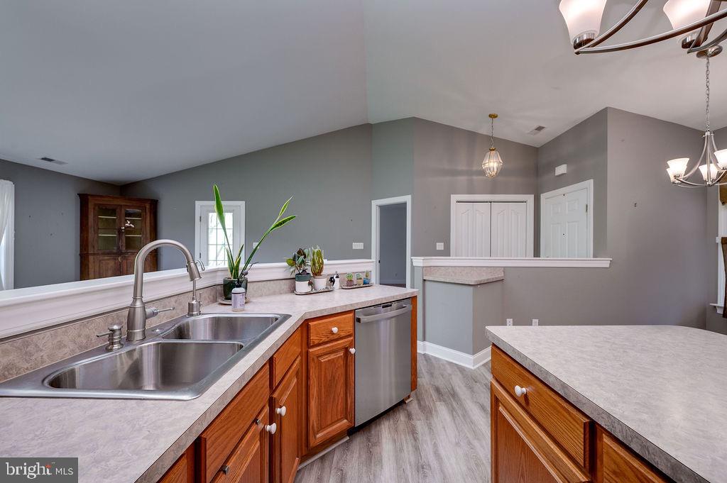 314 Charleston Lane Reading, PA 19610 - Photo 6 of 23 a kitchen with sink cabinets and wooden floor