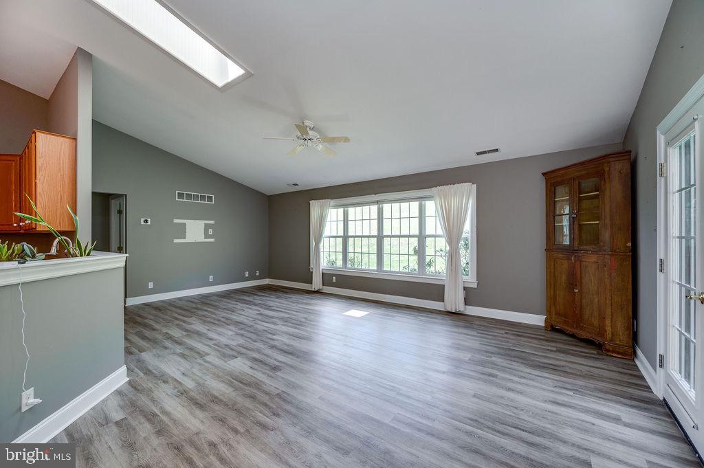 314 Charleston Lane Reading, PA 19610 - Photo 9 of 23 an empty room with wooden floor and windows