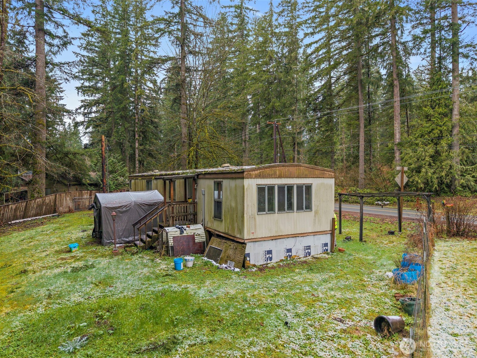 10618 Kelly Road Northeast Carnation, WA 98014 - Photo 8 of 16 a view of a house with backyard and sitting area