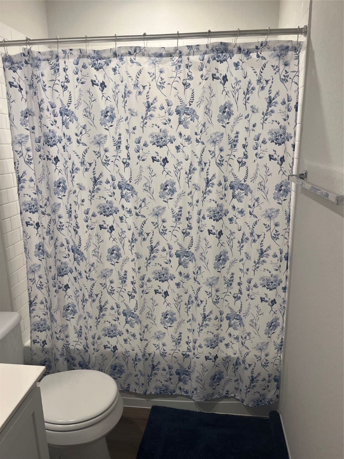 217 Lt. Rusty Jarrell, TX 76537 - Photo 23 of 28 a bathroom with a toilet and a shower curtain