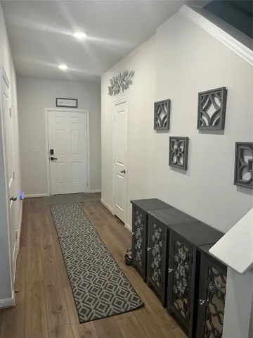 a kitchen with kitchen island granite countertop a sink counter top space appliances and cabinets