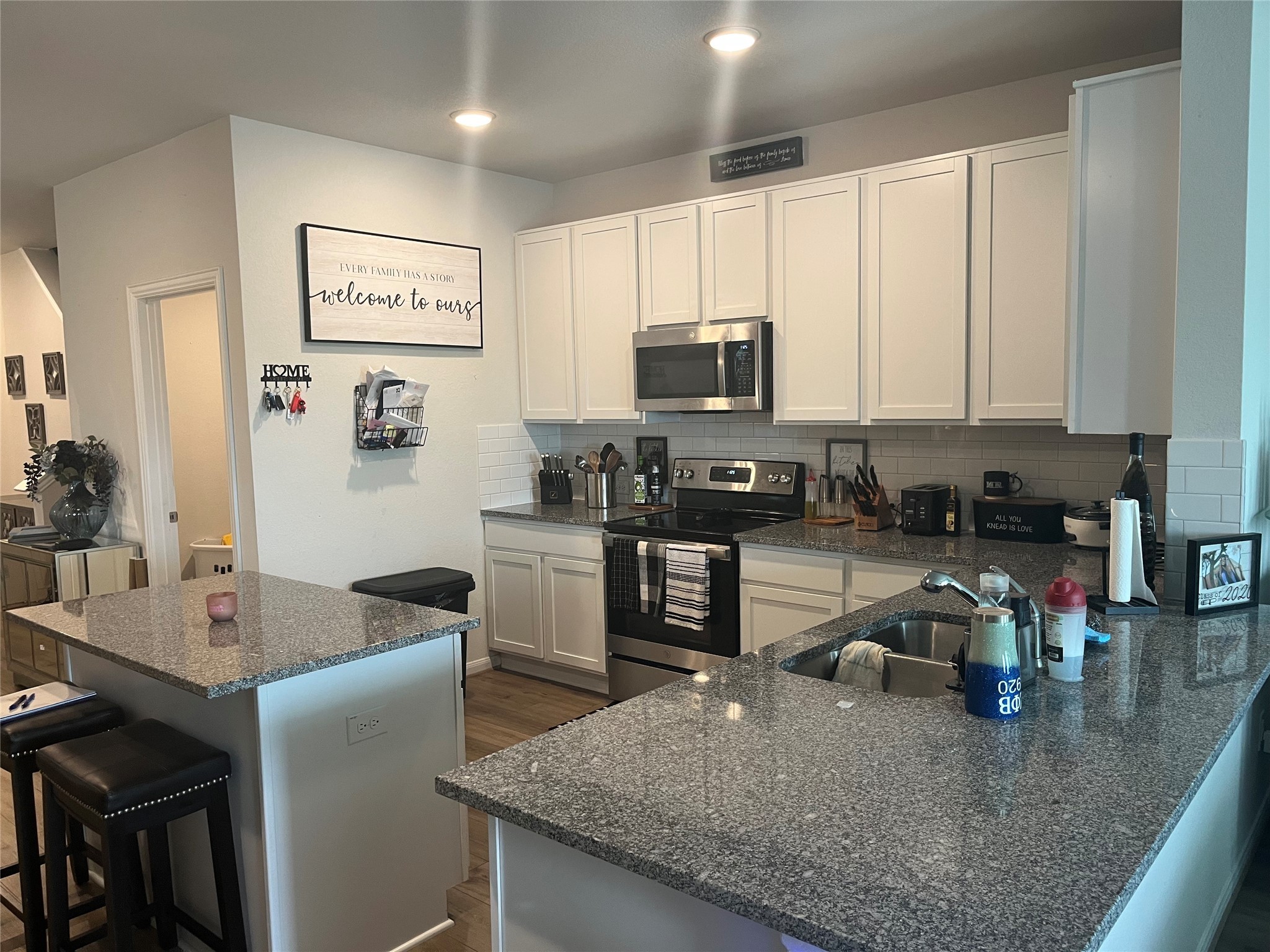 217 Lt. Rusty Jarrell, TX 76537 - Photo 8 of 28 a kitchen with kitchen island granite countertop a sink counter top space appliances and cabinets
