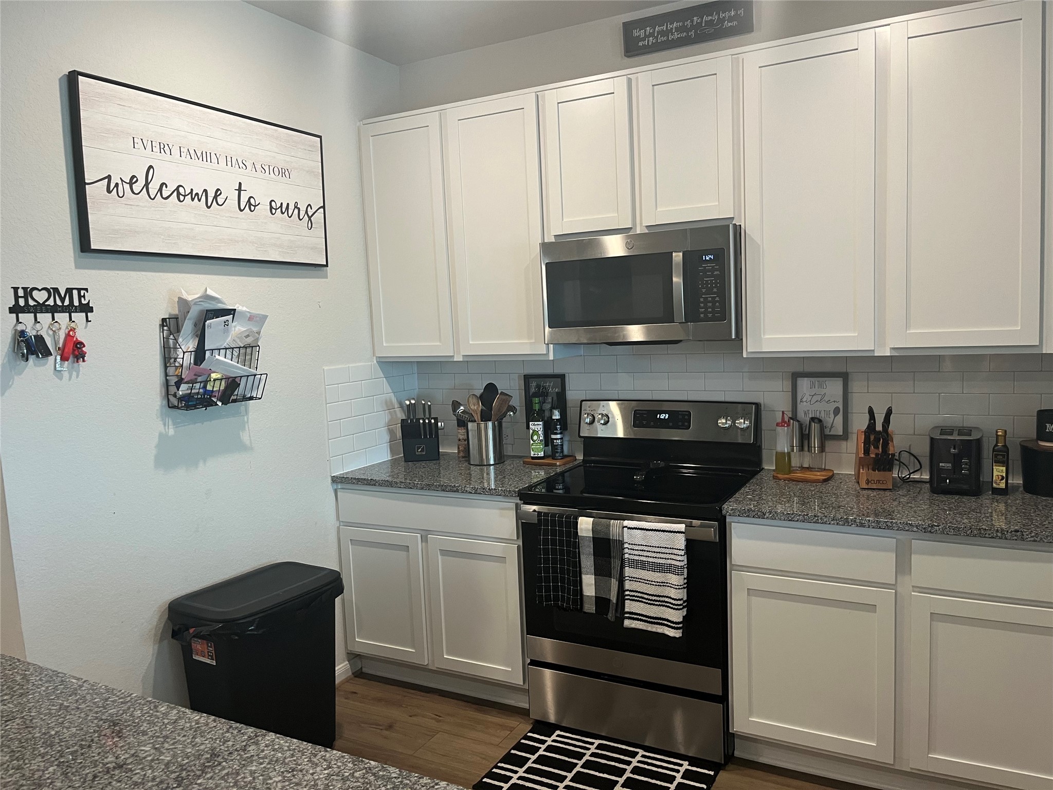 217 Lt. Rusty Jarrell, TX 76537 - Photo 9 of 28 a kitchen with stainless steel appliances granite countertop a stove and a microwave