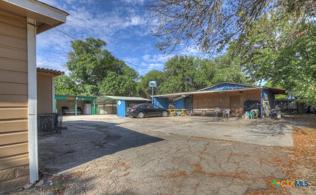 512 Valley Street San Marcos, TX 78666 - Photo 21 of 45 a view of a house with a yard and large tree