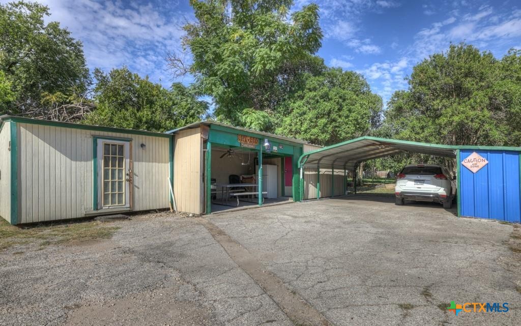 512 Valley Street San Marcos, TX 78666 - Photo 22 of 45 a view of a house with a garage and yard