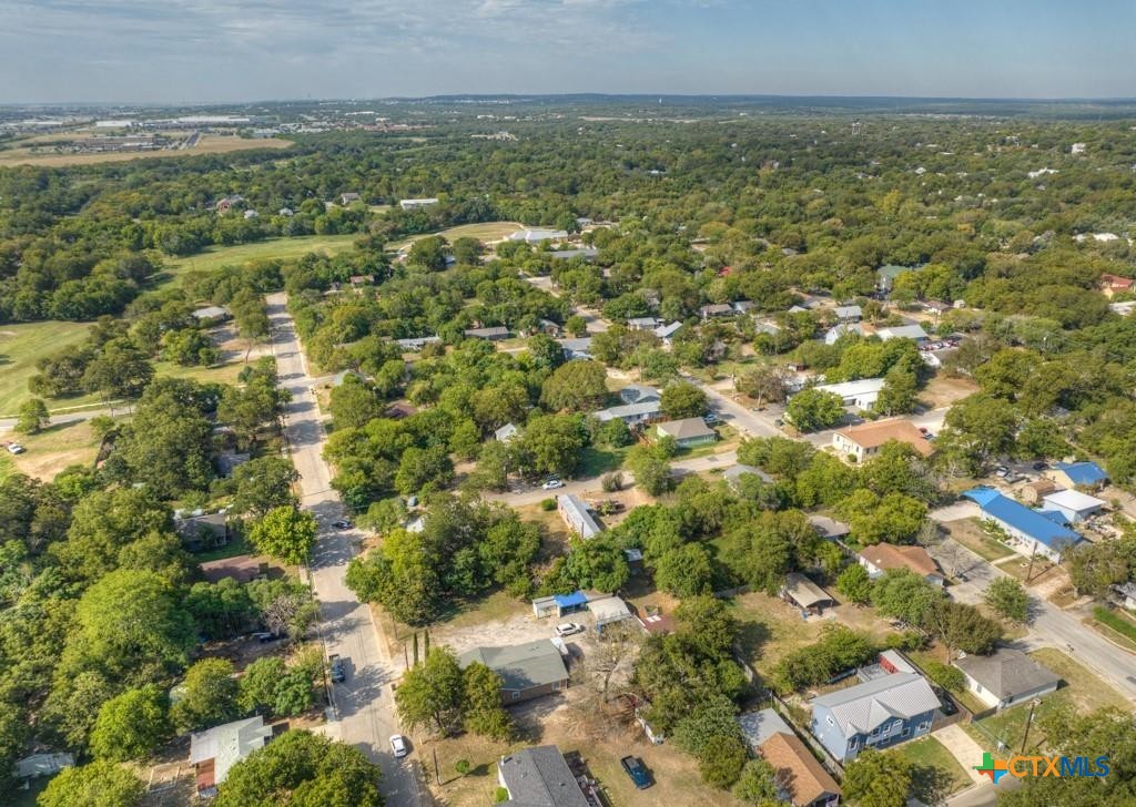 512 Valley Street San Marcos, TX 78666 - Photo 32 of 45 an aerial view of residential houses with outdoor space and trees