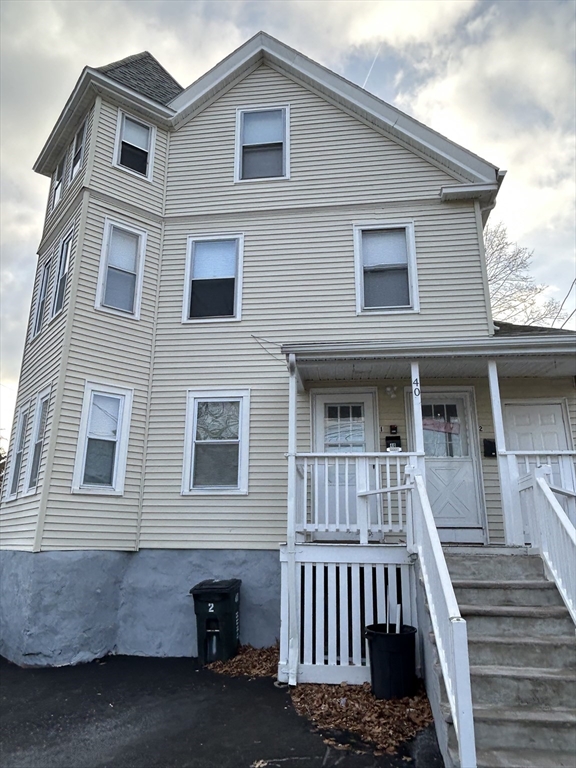 40 Hurd Street, Unit 2 Melrose, MA 02176 - Photo 1 of 1 a front view of a house with stairs