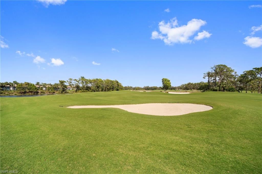 9281 Spring Run Boulevard, Unit 2607 Estero, FL 34135 - Photo 11 of 46 a view of a lake and a yard