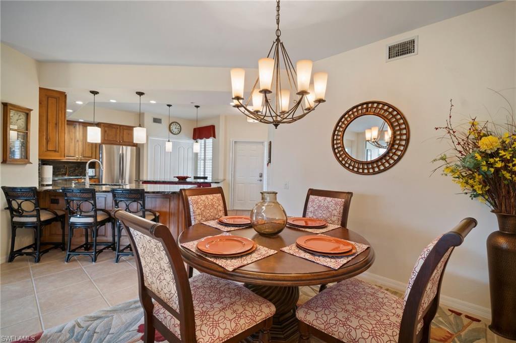 9281 Spring Run Boulevard, Unit 2607 Estero, FL 34135 - Photo 18 of 46 a view of a dining room with furniture