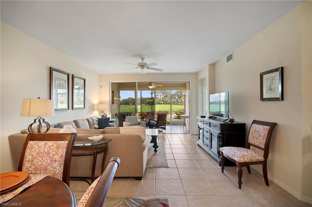 9281 Spring Run Boulevard, Unit 2607 Estero, FL 34135 - Photo 23 of 46 a living room with furniture and a large window