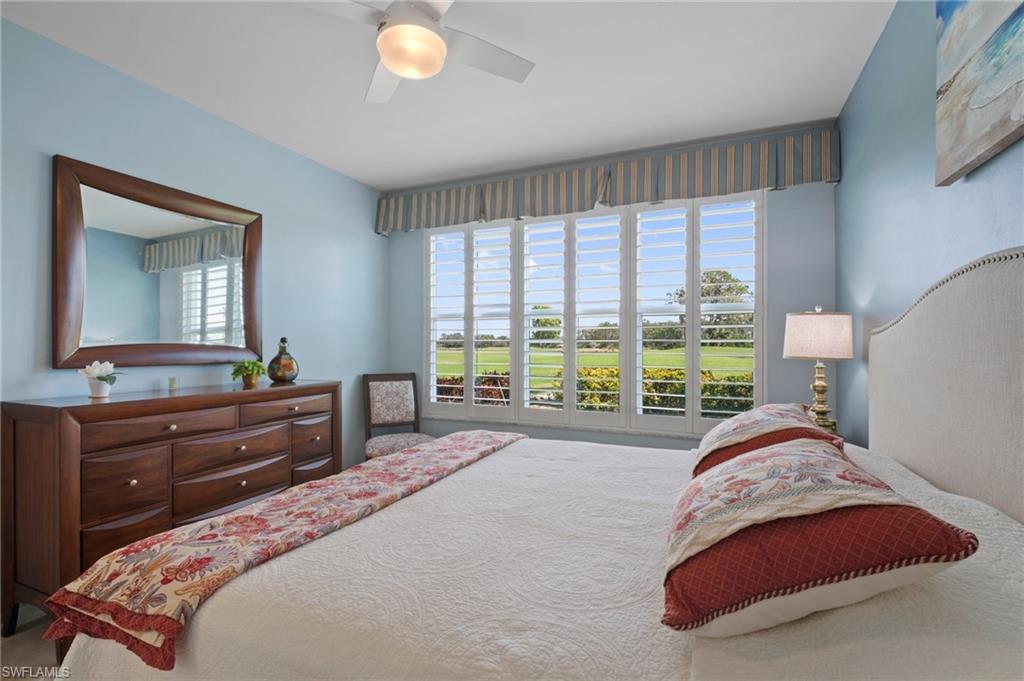 9281 Spring Run Boulevard, Unit 2607 Estero, FL 34135 - Photo 25 of 46 a bedroom with a bed and a large window