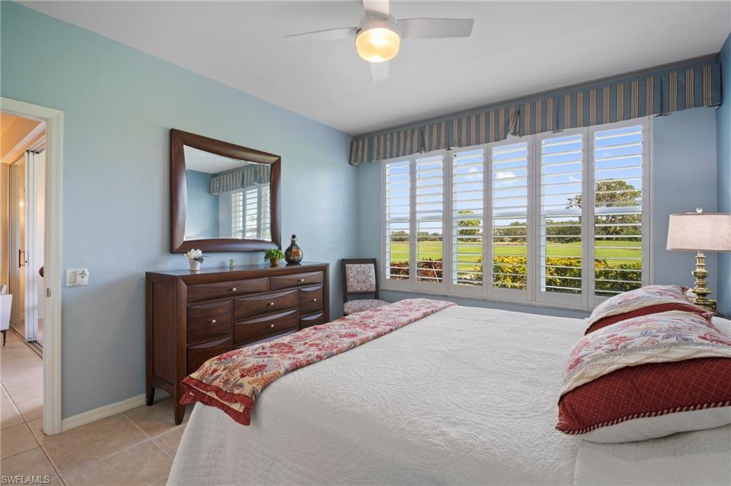 9281 Spring Run Boulevard, Unit 2607 Estero, FL 34135 - Photo 26 of 46 a bedroom with a bed and a dresser