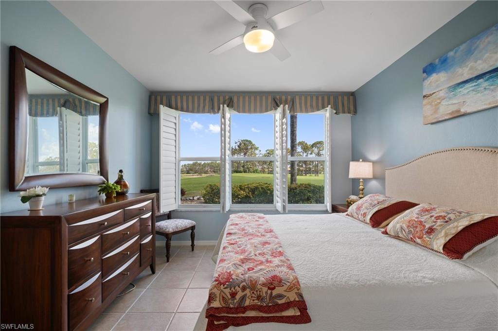 9281 Spring Run Boulevard, Unit 2607 Estero, FL 34135 - Photo 30 of 46 a bed room with a bed and a large window