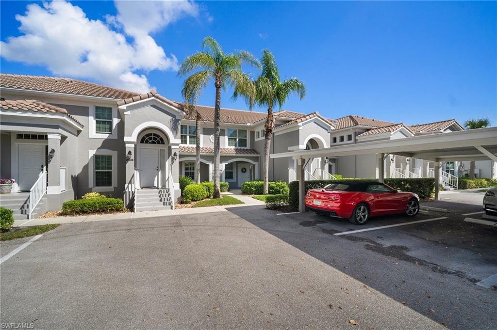 9281 Spring Run Boulevard, Unit 2607 Estero, FL 34135 - Photo 4 of 46 a car parked in front of a building