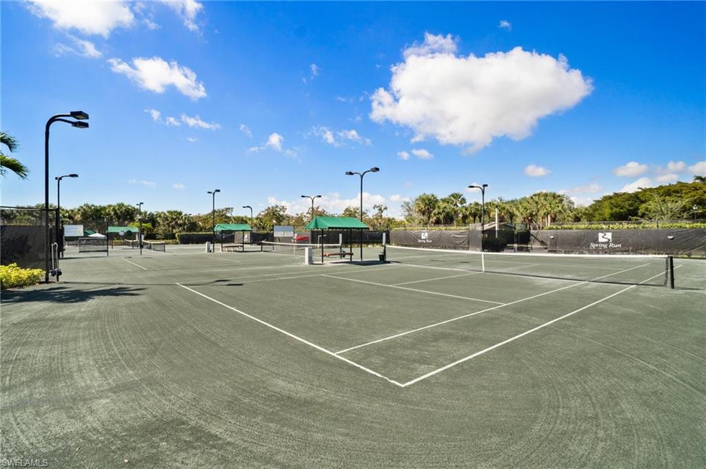 9281 Spring Run Boulevard, Unit 2607 Estero, FL 34135 - Photo 43 of 46 a view of a tennis court