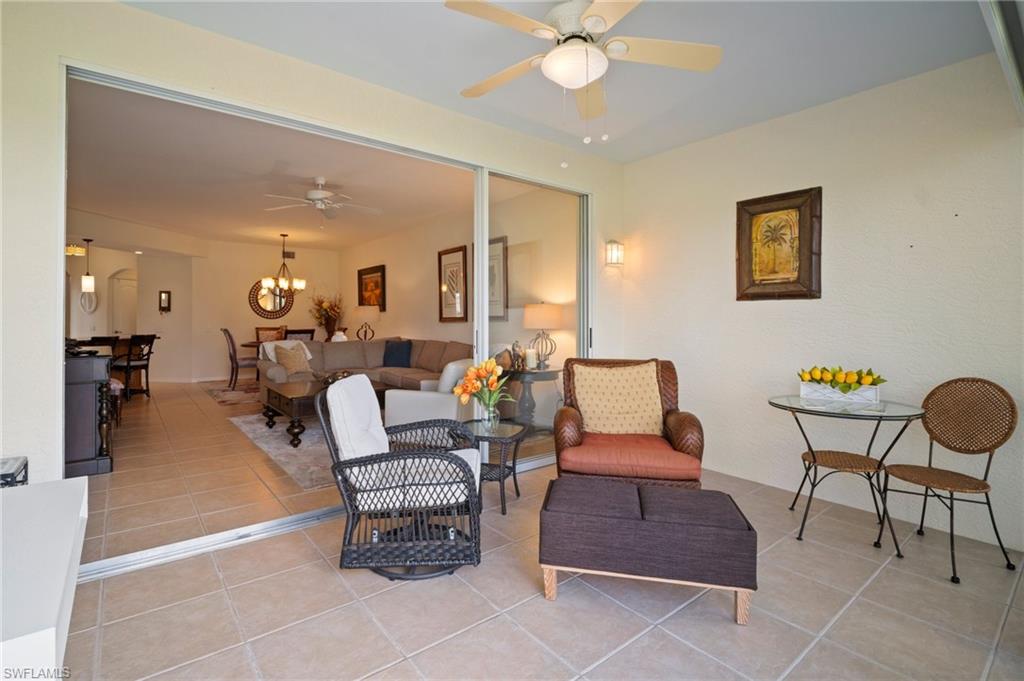 9281 Spring Run Boulevard, Unit 2607 Estero, FL 34135 - Photo 7 of 46 a living room with furniture and a chandelier