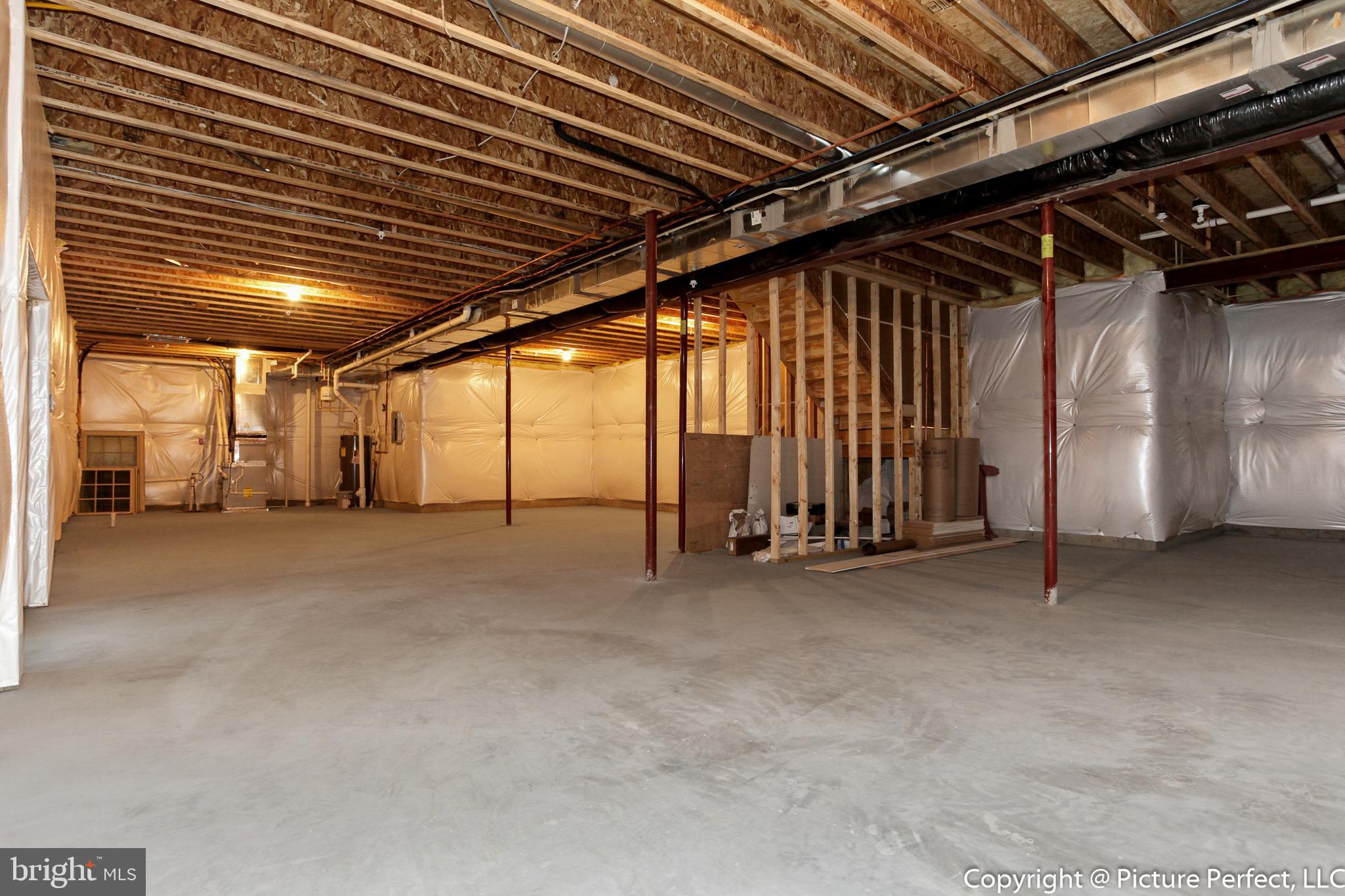 19507 Fisher Avenue, Unit (LOT 3) Poolesville, MD 20837 - Photo 35 of 36 Huge basement with full bath rough-in