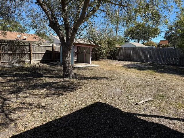 a backyard of a house with lots of green space