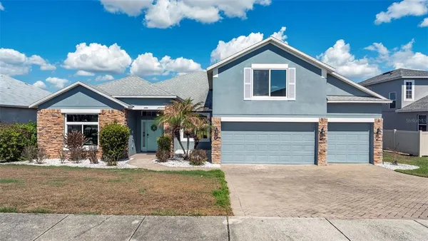 a front view of a house with yard