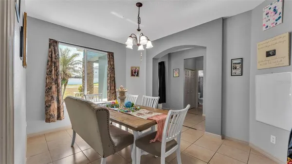 a view of a dining room with furniture window and outside view