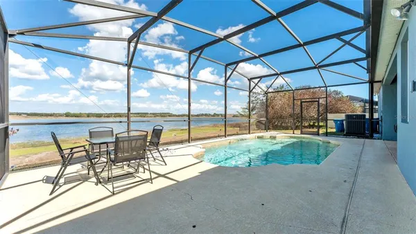 a view of swimming pool with outdoor seating