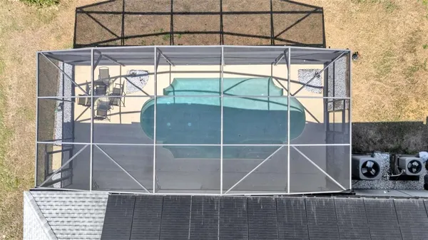 a small white building with a glass door