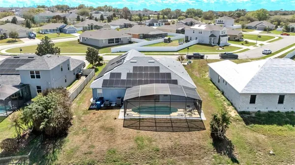 a aerial view of a house with a swimming pool