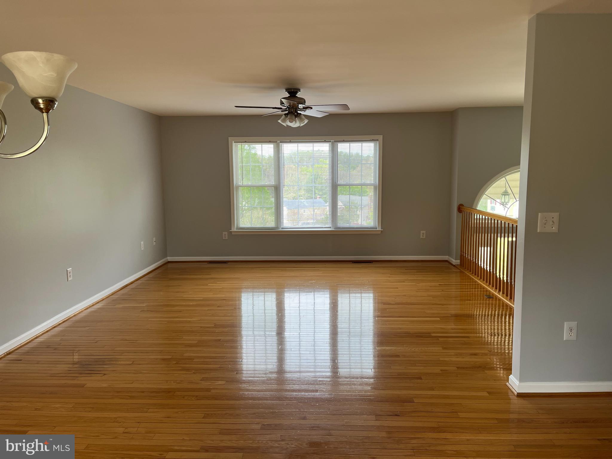 994 View Crest Court Front Royal, VA 22630 - Photo 11 of 24 a view of an empty room with a window and wooden floor