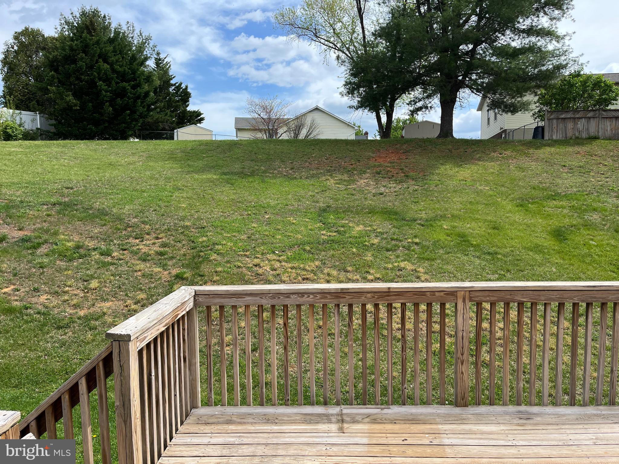994 View Crest Court Front Royal, VA 22630 - Photo 12 of 24 a view of a wooden deck and yard with large trees